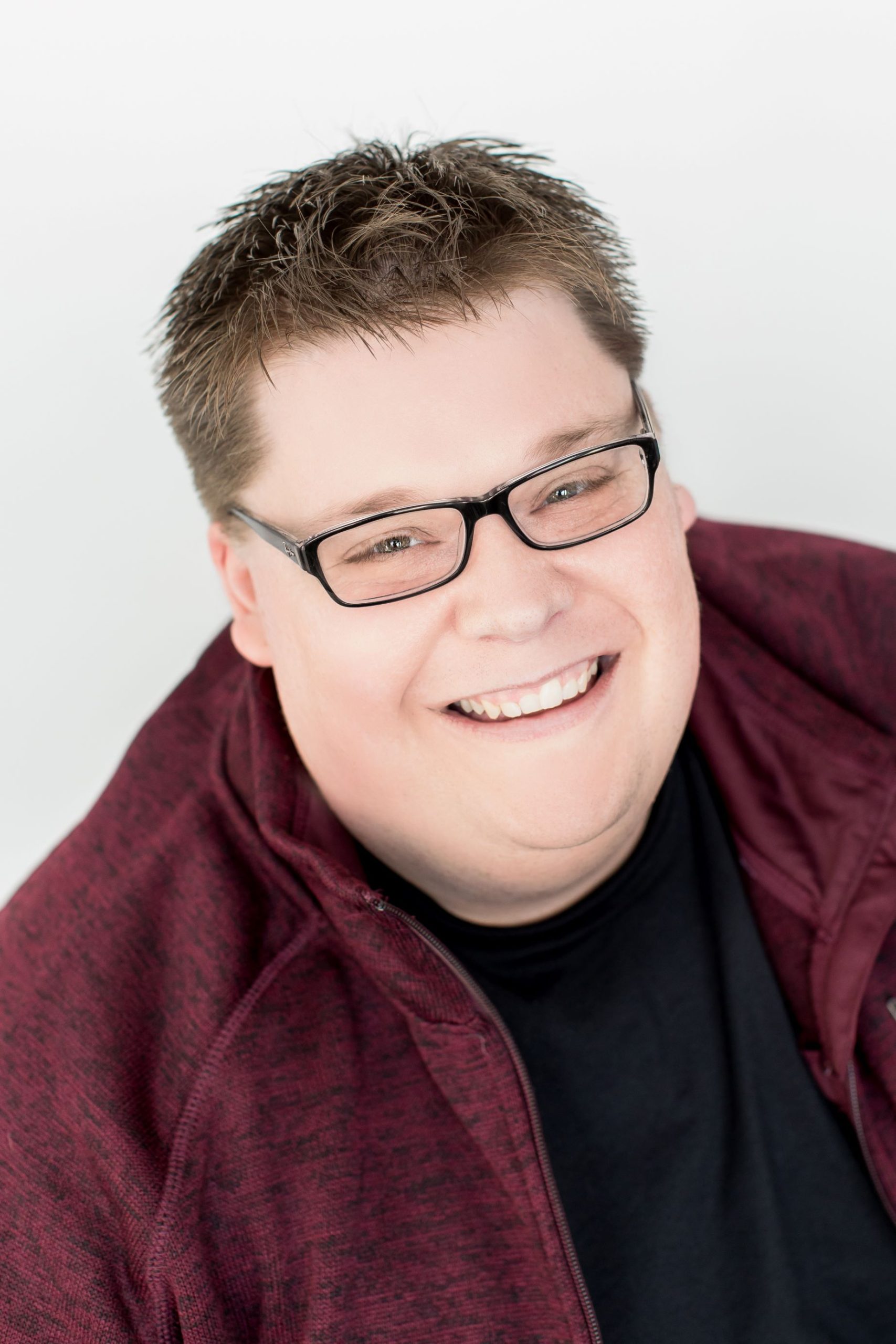Color headshot of Mark Thode smiling, white background